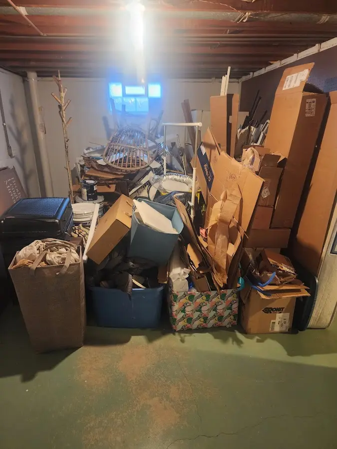 Roll-off dumpster container at job site for 15 Yard Dumpster Rental in Lely