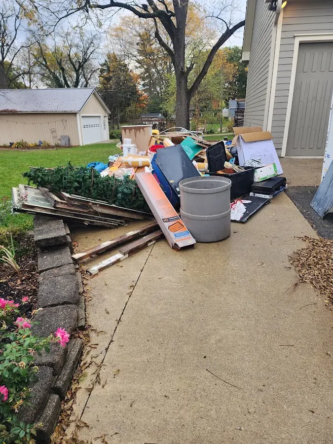 Dumpster being loaded with debris for Commercial Dumpster Rental in Lely